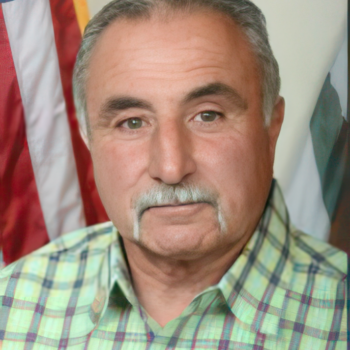 Man smiling with flags background